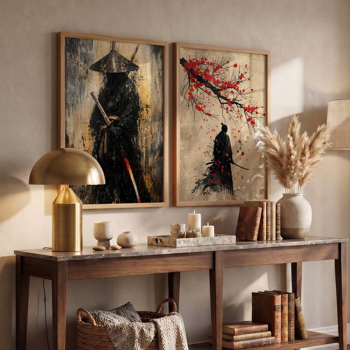 Two framed wall art prints displayed above a console table in a styled interior. The left print shows a dark samurai figure with a sword against a textured beige and black background.